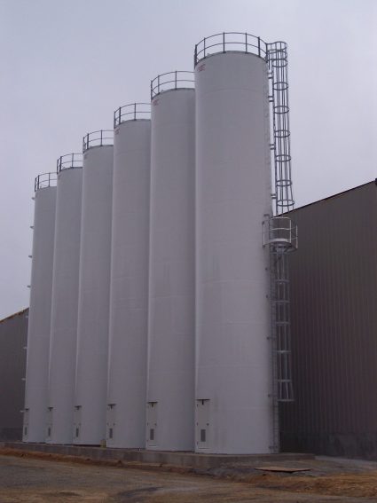 full shot of tall silos